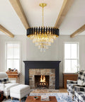 Five Light LED Teardrop Crystal Pendant Chandelier In Gold Finish For Kitchen Island Foyer Hallway And Bedroom Modern Raindrop Ceiling Light With 4000K Neutral White Glow Lit, shown in a cozy living room above a fireplace.