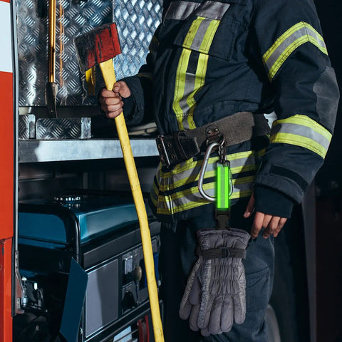 Two Pack Firefighter Glove Straps With Reflective Trim For Turnout Gear clipped to a firefighter's belt, high visibility green.