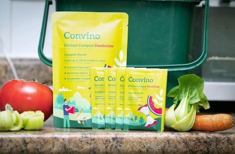 Compost Starter And Odor Reducer Pack That Converts Kitchen Scraps And Yard Waste Into Fertile Humus For All Composting Systems Stops Odors At The Source Includes Four Packets In One Easy No Fuss Package shown on kitchen counter with vegetables