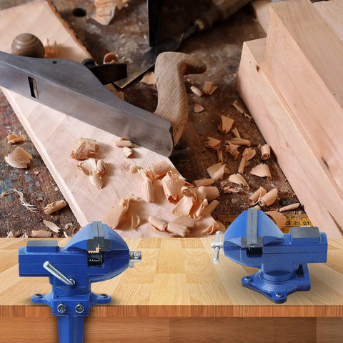 Heavy Duty Table Vise With Swivel Base For Woodworking And Metalworking, shown on a workbench with wood shavings and tools