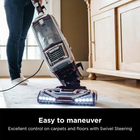Shark Rotator Powered Lift Away TruePet Upright Vacuum With Hepa Filter large dust cup capacity in use on carpet with swivel steering.