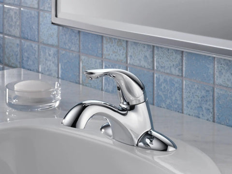 Chrome 3-Hole 4-Inch Kitchen Faucet with Diamond Seal Tech and InnoFlex PEX Supply Lines, mounted on white sink, bathroom setting