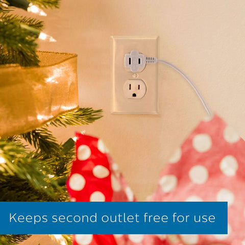 Plug In Footswitch With 9 Foot Flat Plug Extension Cord connected to wall outlet near Christmas tree