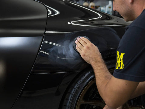 Applying All In One Car Wax Cleaner that cleans dirt grime and water spots removes light scratches and defects polishes to a slick shine