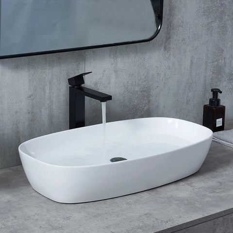 28x15 Inch Oval Porcelain Vessel Sink White Ceramic Above Counter Bathroom Basin for Vanity Cabinet with water running faucet