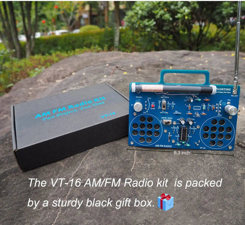 AM FM Radio Kit For DIY Soldering Projects And Electronics Teaching Hands On STEM Gift shown with black gift box outdoors