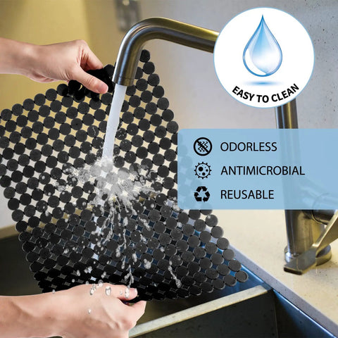 Two Pack Adjustable Kitchen Sink Mat With Fast Draining Design being washed under faucet, PVC material, easy to clean and maintain