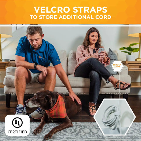 Living room with flat plug sofa power cord, velcro straps for cord storage, and couple on couch with dog, space saving setup