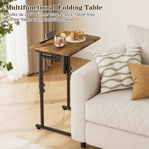 Adjustable Folding TV Tray Table For Eating And Snacking, 6 Height Levels next to a couch with snacks on top, shown in brown.