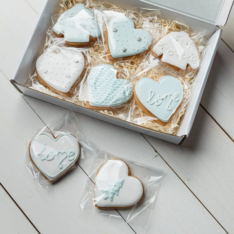 200 Pack Of Freakin Tough Clear Cellophane Cookie Bags Resealable Treat Sacks Heavy Duty Self Sealing Film For Fresh Bakery Goods And Sweet Party Wrapping with decorated cookies in a box.