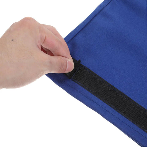 A hand adjusting the Velcro strap on the Tough As Nails Heat Resistant Welding Sleeves Fireproof Arm Protectors Blue.