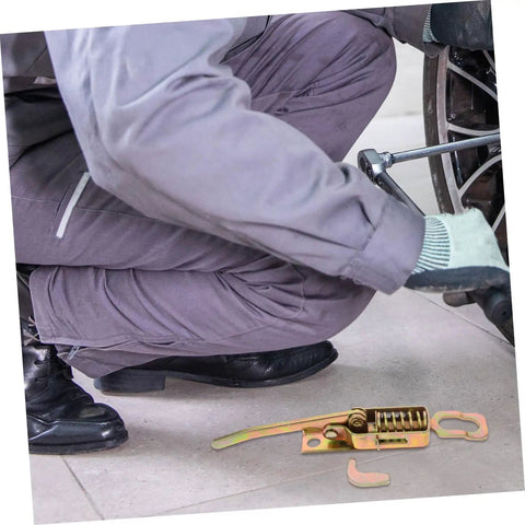 Beefy Heavy Duty Toggle Latch Clamp Kit with adjustable metal pull hasp next to mechanic working on vehicle wheel.