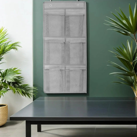 Slick Door Shoe Organizer With Six Deep Mesh Pockets And Heavy Duty Hanging Hooks For No Fuss Entryway Tidy Up on a wall.