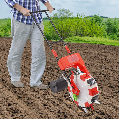 Person using the Six Row Hand Push Garden Seeder With Precision Seed Metering And Adjustable Depth And Spacing on soil