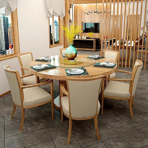 Heavy Duty Tempered Glass Lazy Susan Rotating Serving Plate With Hella Smooth Aluminum Bearing Swivel Base Built Damn Tough For Kitchen Countertops Banquet Tables And House Parties on a round wooden dining table with chairs.