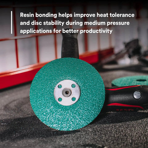Green Corps Fiber Disc 36507 5 Inch By 7/8 Inch Ceramic Resin Bond Abrasive Disc shown attached to a grinder on a workbench