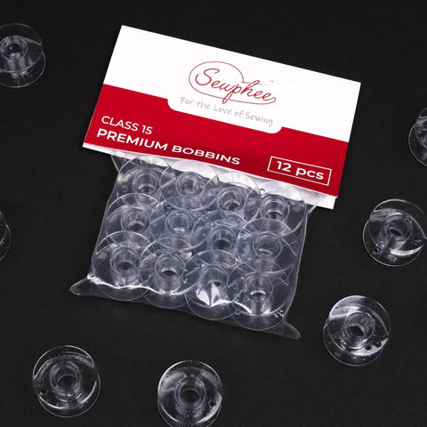 12 Pcs Premium Class 15 Sewing Machine Bobbins Plastic With Superior Thread Grip Pro Grade Precision Made In Taiwan For Smooth Consistent Stitches Wide Compatibility With Most Domestic And Industrial Sewing Machines. clear plastic Class 15 bobbins in 12-piece pack