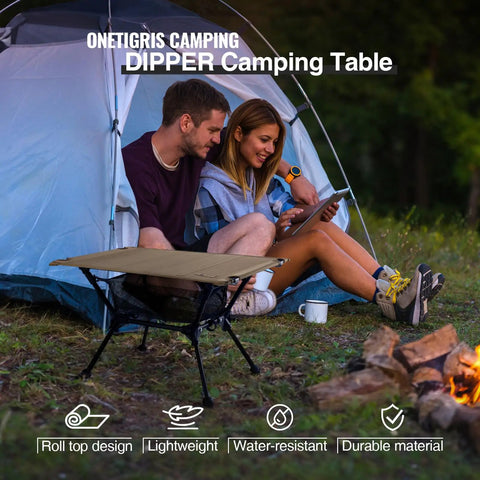 Couple using Dipper Camping Table Lightweight Portable Folding Table With Mesh Storage Net ideal for camping by campfire