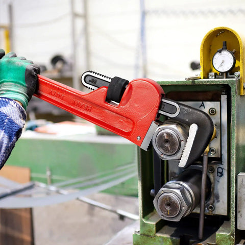 36 Inch Heavy Duty Pipe Wrench With Adjustable Aluminum Body And Floating Hook Jaw Rust Resistant Red I Beam Handle Rugged Grip For Industrial Plumbing And Tough Pipe Jobs in use on machinery