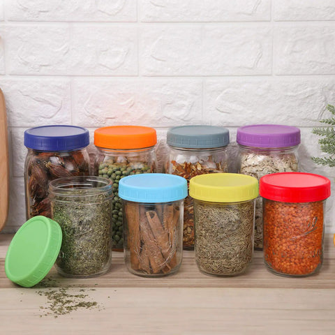 Hella Versatile Wide Mouth Mason Jar Lids 16 Pack Dope Colored Plastic Caps For Ball And Kerr Canning Jars Featuring Legit Leak Proof Food Grade Storage Covers That Make Your Pantry Pop with jars filled with spices.