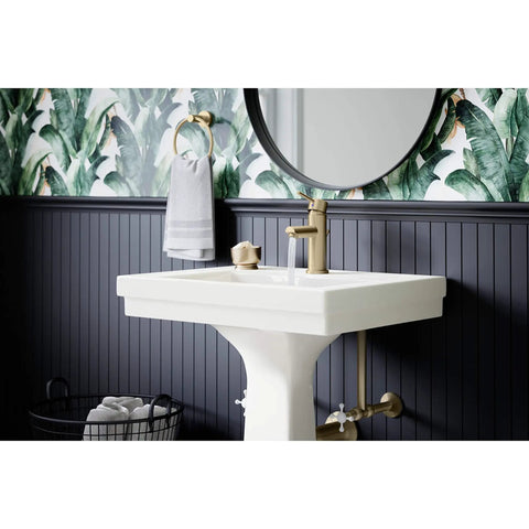 Low-Flow Brushed Bronze Single Hole Bathroom Faucet With Drain Assembly on a white pedestal sink in a modern bathroom.