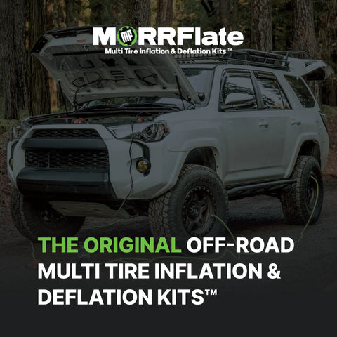 SUV with hood open in forest equipped with off-road multi tire inflation deflation kit