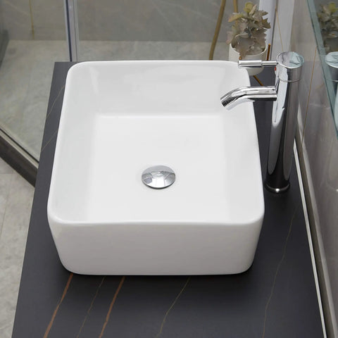 Rectangle Vessel Sink With Pop Up Drain Included For Above Counter Bathroom White Porcelain Ceramic Vanity Basin 14.6 X 18.9 X 5.2 Inches Without Faucet Hole shown installed on vanity