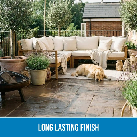 Patio with couch, plants, and a dog on wet-look stone sealed with SP-1104 Gloss Sealer 5 Gallon Ready To Use Wet Look Water Repellent.