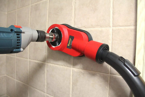 Universal Drilling Dust Shroud With Vacuum Suction for clean wall drilling with grey rotary hammer attached to red shroud.