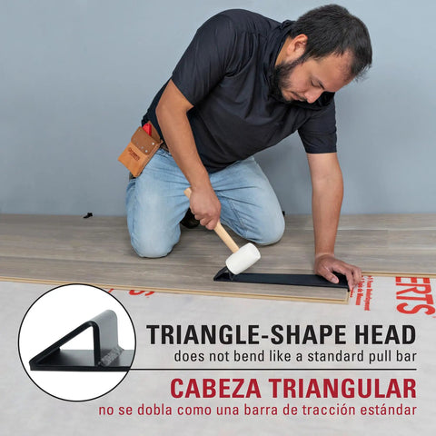 Man using Maverick Wide Angle Pull Bar for Vinyl Laminate and Wood Flooring Installations Triangular Head Absorbs 10x Strike Force