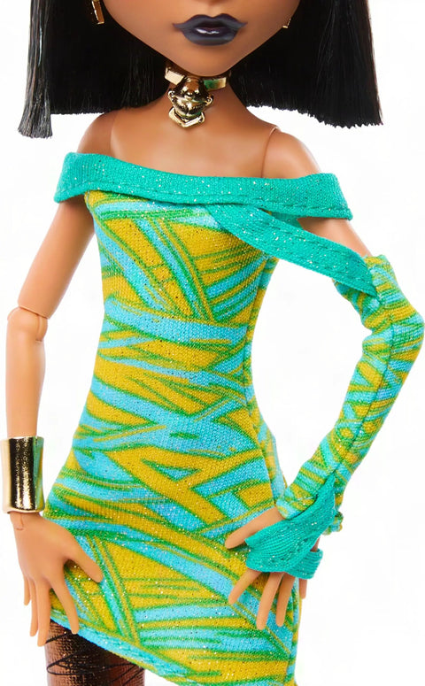 Cleo De Nile Fashion Figure Featuring A Chic Asymmetric Wrap Dress And Bold Over The Shoulder Neckline, vibrant dress detail.