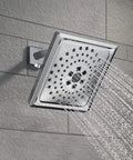 3-Setting Chrome Rain Shower Head With H2Okinetic Spray, 7.5 Inch Square, displaying water flow against wall