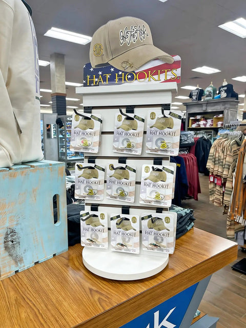 Two Sided Slatwall Counter Spinner Display Rack In Maple Finish For Giftware And Jewelry, Rotating Spin Rack With Black Base, showcasing Hat Hooks.