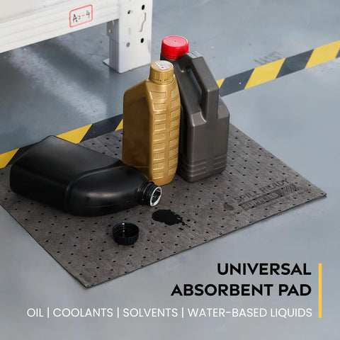 Heavy Duty Universal Absorbent Pads 10 X 13 Inch 100 Pack No Sweat Cleanup Tough As Nails Pads on workshop floor with oil bottles.