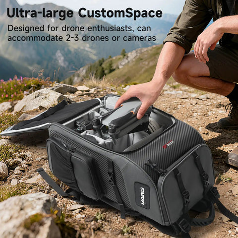 40L Outdoor Drone Backpack With DIY One Piece Partition Ultra Roomy Space For 2 To 3 Drones Or Cameras Fits Mavic 4 Pro Air 3S Avata 360 Mini 5 Pro And Accessories Ready For Any Adventure open on rocky terrain showing compartments and gear