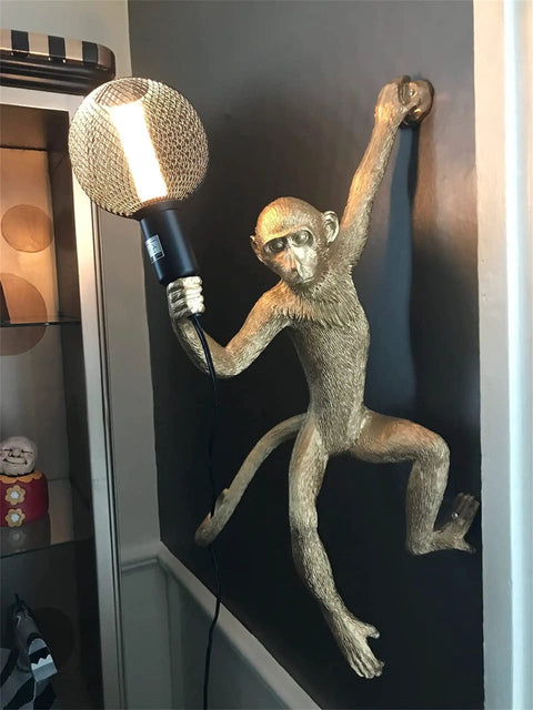 Dope Modern Resin Monkey Wall And Table Lamp With Hemp Rope Pendant Light For Home Decor White Finish mounted on a dark wall.