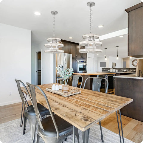 14 Inch Farmhouse Open Drum Pendant Light With Cylinder Glass Shade In White Ash Wood Style And Galvanized Steel Finish over kitchen table.