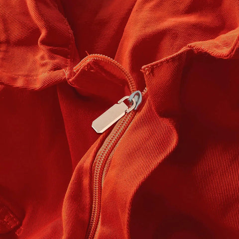 Heavy Duty Zinc Alloy Zipper Pull Tabs Replacement Kit For Backpacks Coats Jackets 12 Piece Set on an orange jacket zipper.