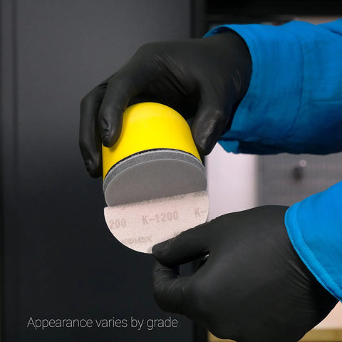 3 Inch Sanding Disc Starter Kit With K600 To K1500 Grits, 25 Discs, One Interface Pad, And Palm Sander, close-up of disc and pad.
