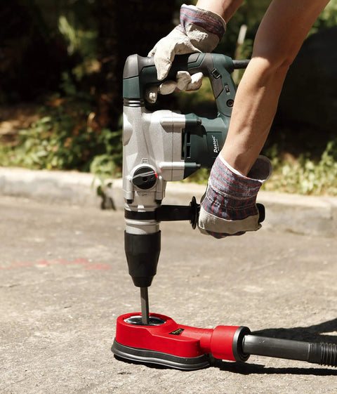 Universal Drilling Dust Shroud With Vacuum Suction For Three Eighths To Two And Five Eighths Inch Holes in use on concrete