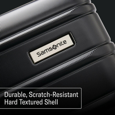 Close-up of Samsonite expandable luggage set's scratch-resistant hard shell with logo.