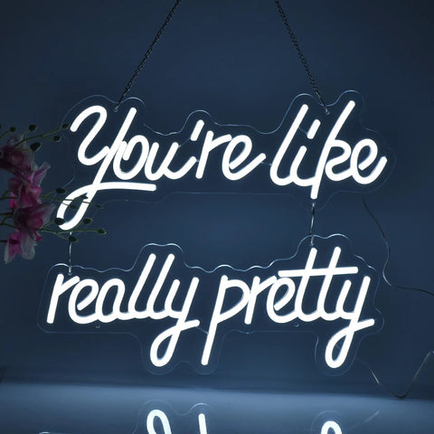 Youre Like Really Pretty White LED Neon Sign For Wall Decor With Adjustable Brightness Levels glowing in dark setting