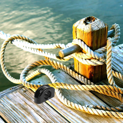 Pair Of Large Nylon Kayak Pulleys With Rolling Bearings For Smooth Wire Guidance On Boats Canoes Yachts And Fishing Gear Heavy Duty Nylon Guide Wheel Set attached to dock with ropes.