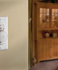 Wall-mounted 24 Hour Programmable Mechanical Security Timer For Home Use 120V Auto On Off Scheduling in a home living room.
