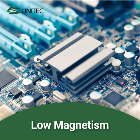 Close-up of a computer motherboard with a focus on a low magnetism component and connection slots.