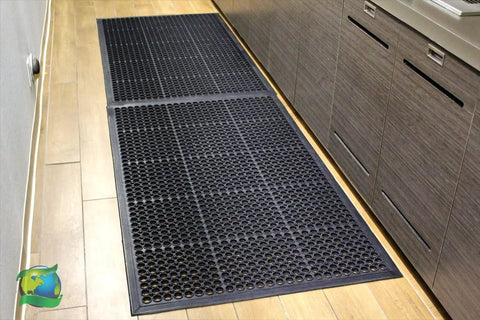 Anti Fatigue Rubber Floor Mat With Drainage Holes For High Traffic Areas Grippy Non Slip Doormat installed in a kitchen