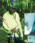 Arborist holding Rope Sniper Pro Arborist Tool For Effortless Rope Placement And Laser Sharp Precision On Challenging Jobs.