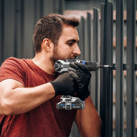 Man using Beast Of A 20V Max Cordless Drill Set With Lithium Battery And Charger Three Eighth Inch Keyless Chuck