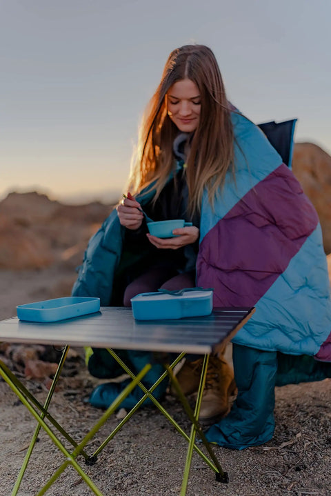 Using Grab And Go Self Contained Mess Kit With BPA Free Construction And All In One Eating Utensils for camping on a foldable table