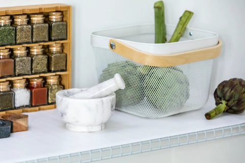 Non Adhesive Shelf Liners For Kitchen Cabinets And Pantry Wire Shelving Featuring A Solid Grip Base Locking Items In Place And Keeping Craziness Contained Machine Washable White 6 Roll Pack with a marble mortar and herbs.